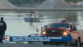 Police in Bay City trying to identify human remains found along river