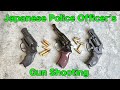 Japanese police officer shooting an airsoft model gun