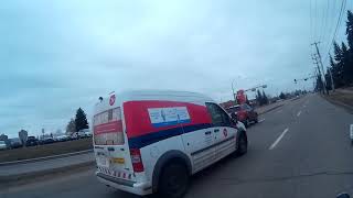 DUMB KAREN IN HER FORD THE DUMB CANADA POST WORKER CUTS OFF BIKER DRUNK OR HIGH DRIVER