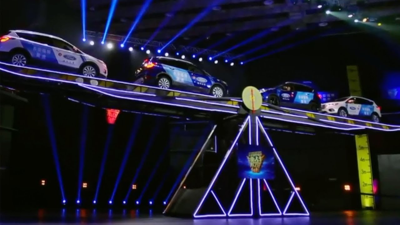 Impossible challenge: Veterans balance giant seesaw with cars