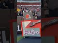 Voice of the Browns Jim Donovan performs ceremonial guitar smash before Browns-Steelers game