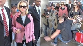 Photographer Falls At January Jones' Feet At LAX