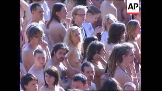 Almost 2,000 strip for photo shoot in soccer stadium