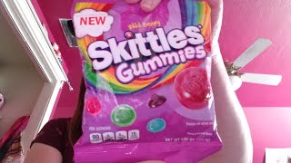 Mena Taste Testing Wild Berry Skittles Gummies