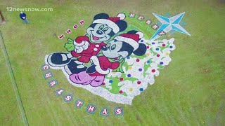 Vidor man celebrates holidays with large yard paintings