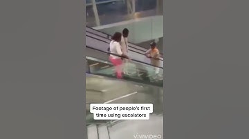 Reply to @yoo_stash footage of a couple  using escalators for the first time at a new mall in Camer