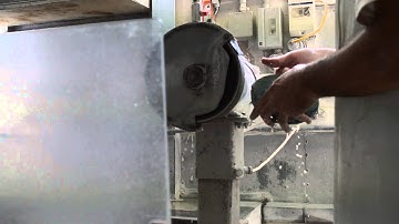 Cleaning of Paua Shell in our Factory