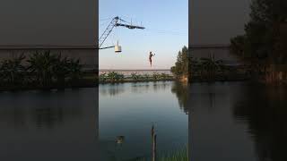 Girl does front flip on barrier into water and ends up doing a belly flop