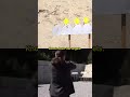 Shooting while standing on stability balls with a kettlebell