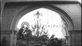 US 111th Infantry troops rest in the ruins of a church and French officers at the...HD Stock Footage
