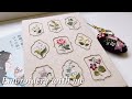 蓬莱和歌子さんの『刺繍で綴る日々の装い』から花のラベルのサンプラー🌹を刺繍しました🪡はじめてのパネル仕立てembroidery bordado 자수