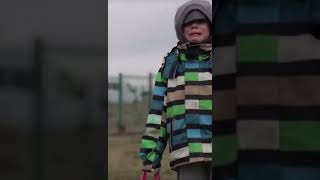 Ukrainian boy crying while crossing Poland border