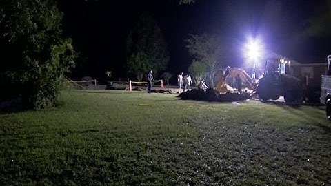 Crews work to fill in a huge sinkhole in Lake County