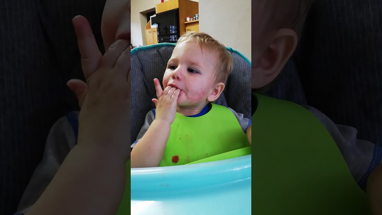 Emmit in high chair exhibiting seizures for "Eating with Emmit" Blog