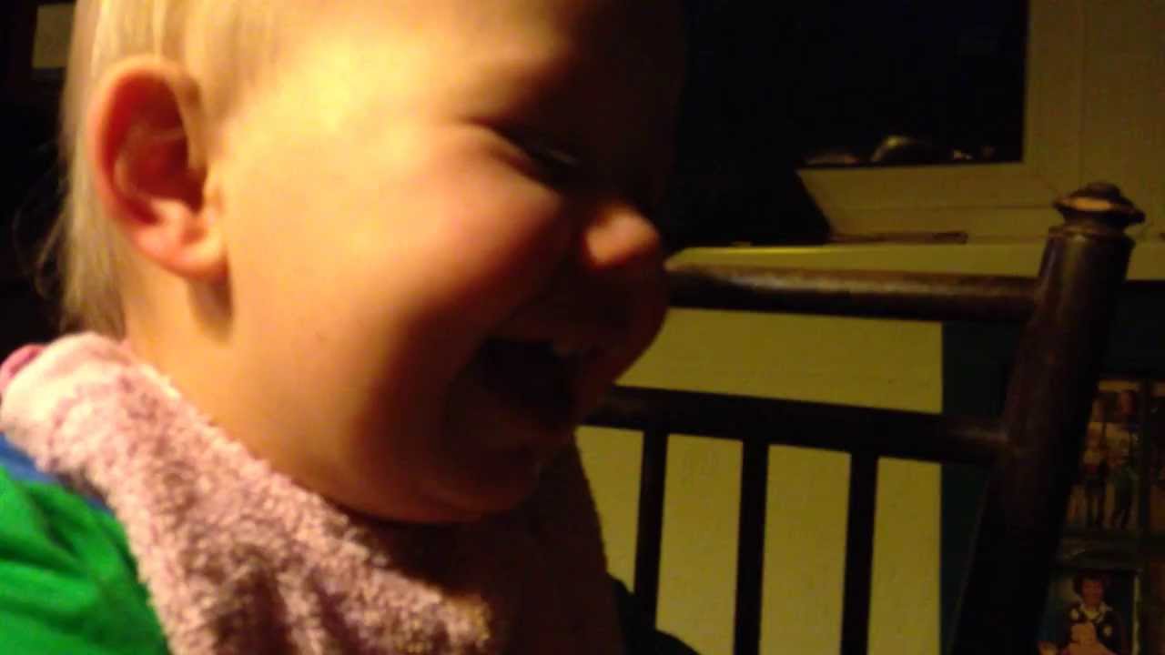 Baby laughing hysterically about her mom doing sit ups