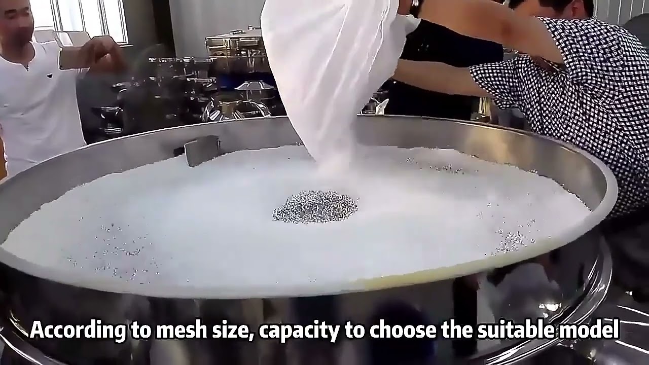 White particles are sieved without material through a rotary vibrating screen.