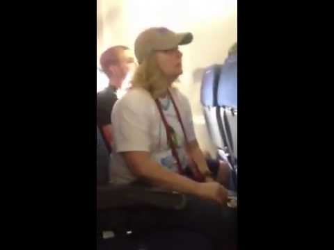 Woman Smokes On A Plane