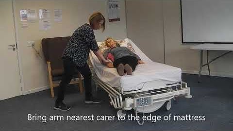 Assist a person to sit up in bed from lying flat