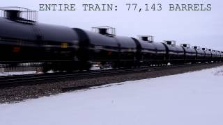 Oil tank car train travels along Upper Mississippi River Refuge