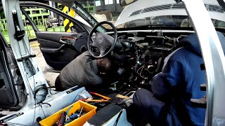 process of disassembling a Mercedes-Benz car by a Korean technician with flamboyant hand movements.