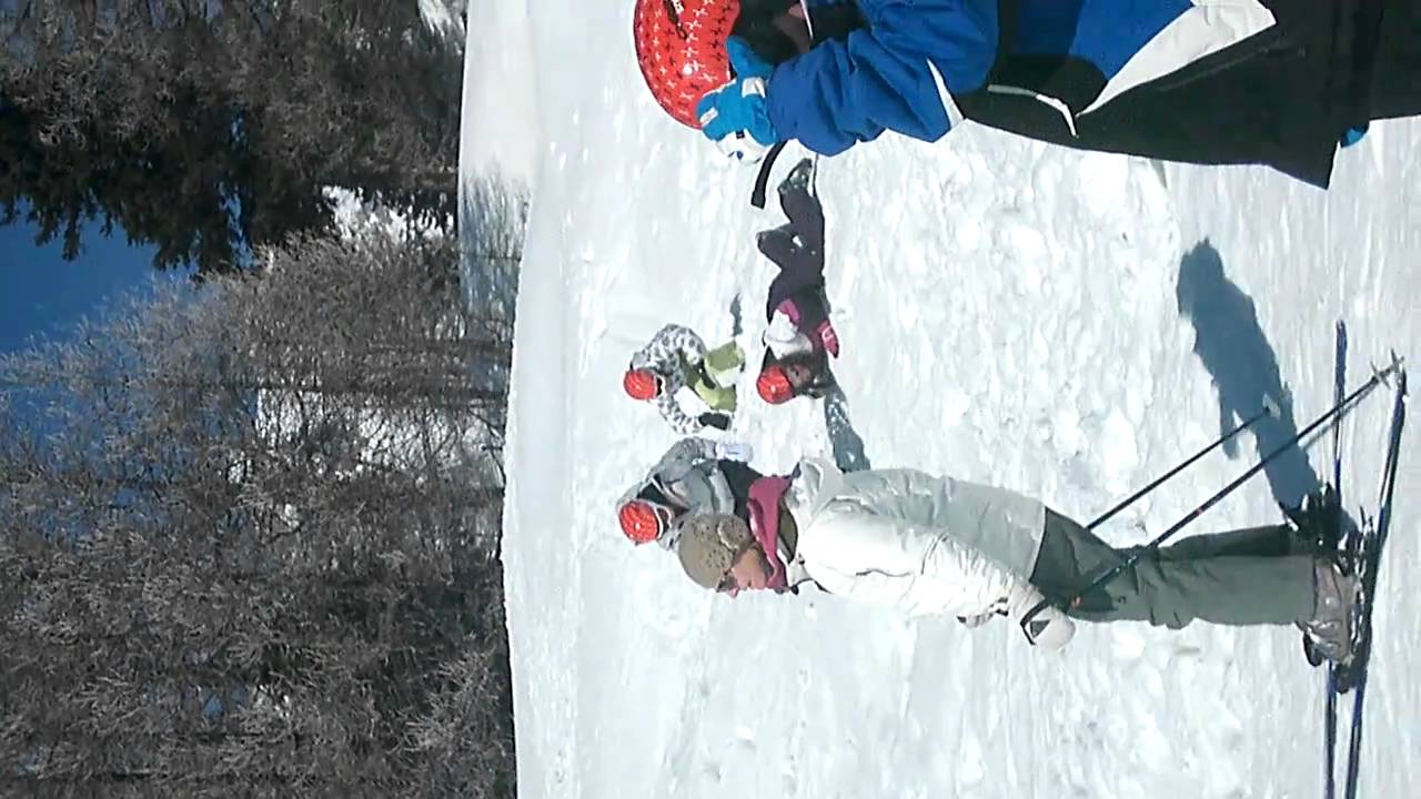 sian and hannah running up a hill in ski boots
