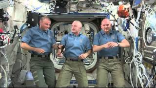 Space station astronauts talk with the media about life in space