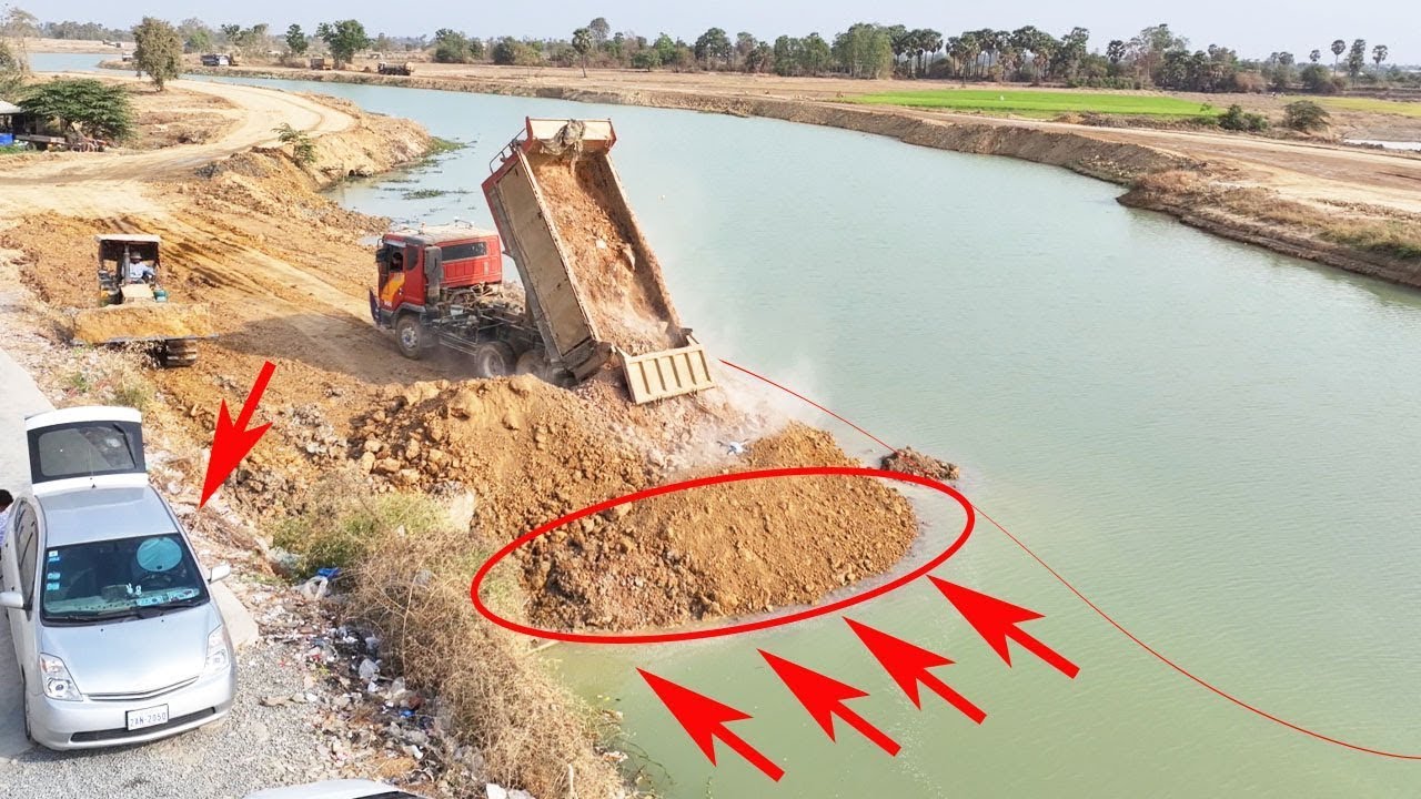 Road Resizing Project Update Using KOMATSU D31 Bulldozer and Dump Trucks for Canal Expansion