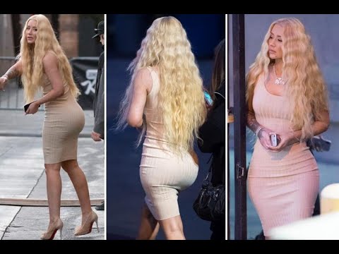 Iggy Azalea shows off her incredible figure in skintight nude dress