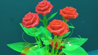 rose flower with leaves made out of soda bottle & drinking straw