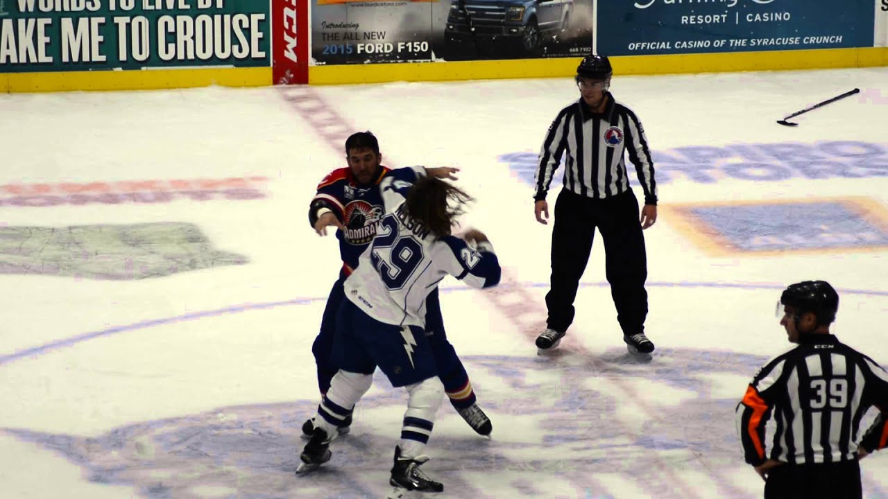 Crunch's Eric Neilson fights the Admirals' Steve MacIntyre