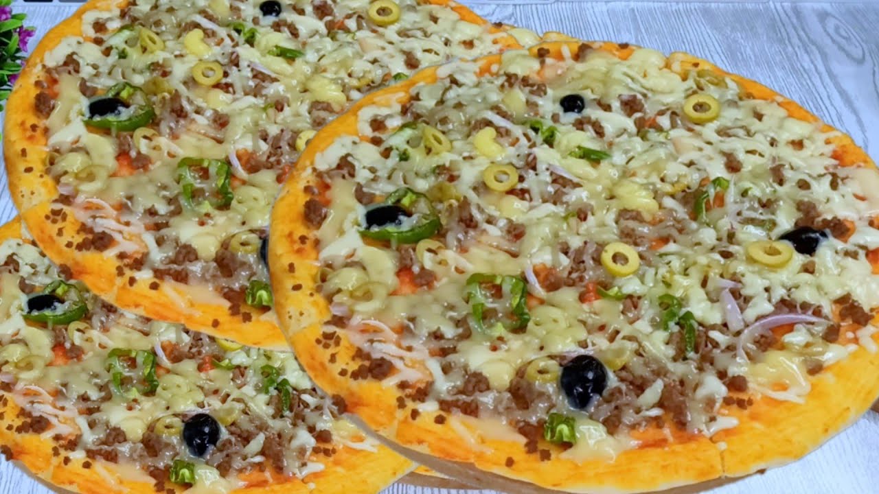 بيتزا  بدون بيض ولا حليب  ولا دلك عجين مميز  خفيفة رطبة اقتصادية ترجع الوصفة المعتمدة عندكم