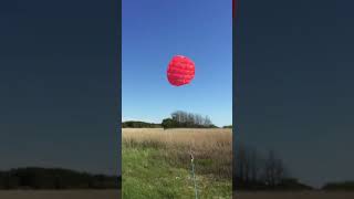 Single line kite connected to a scale