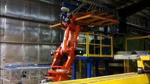 comau robot-demo for mirror centring gluing and droping on reflector