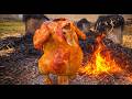 Whole Chicken Cooked Under a Bucket Over Fire