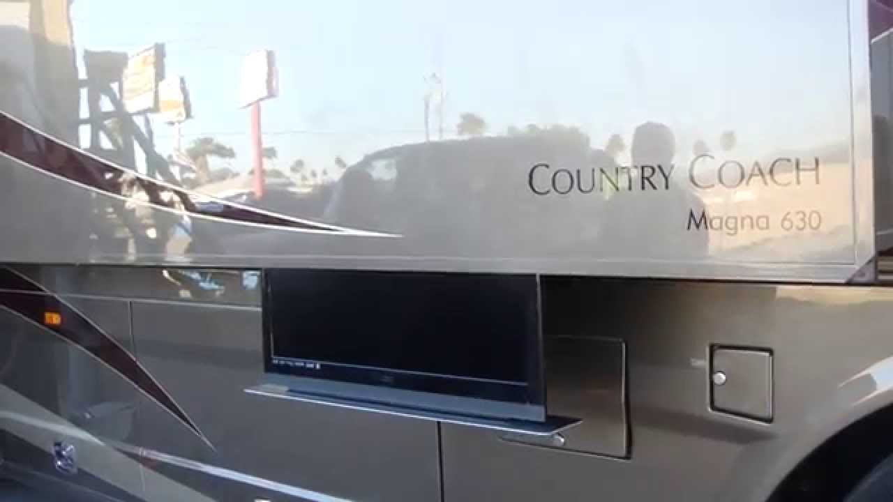 Hideaway motorized TV installed in the slideout of a custom RV by RV