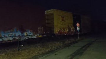 CSX LOCAL F-797 LEAD BY GE ES40DC 5243 RUNNING LONG HOOD FORWARD. SWITCHING IN GREENVILLE.(3)