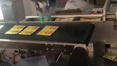 Fast move spider type robot hand bag picking up sorting feeding system for cartoning line