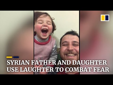 Syria war: father and daughter living in battle zone turn sound of bombs into a game