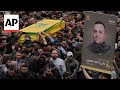 Hezbollah members hold funeral for commander killed in israeli airstrike