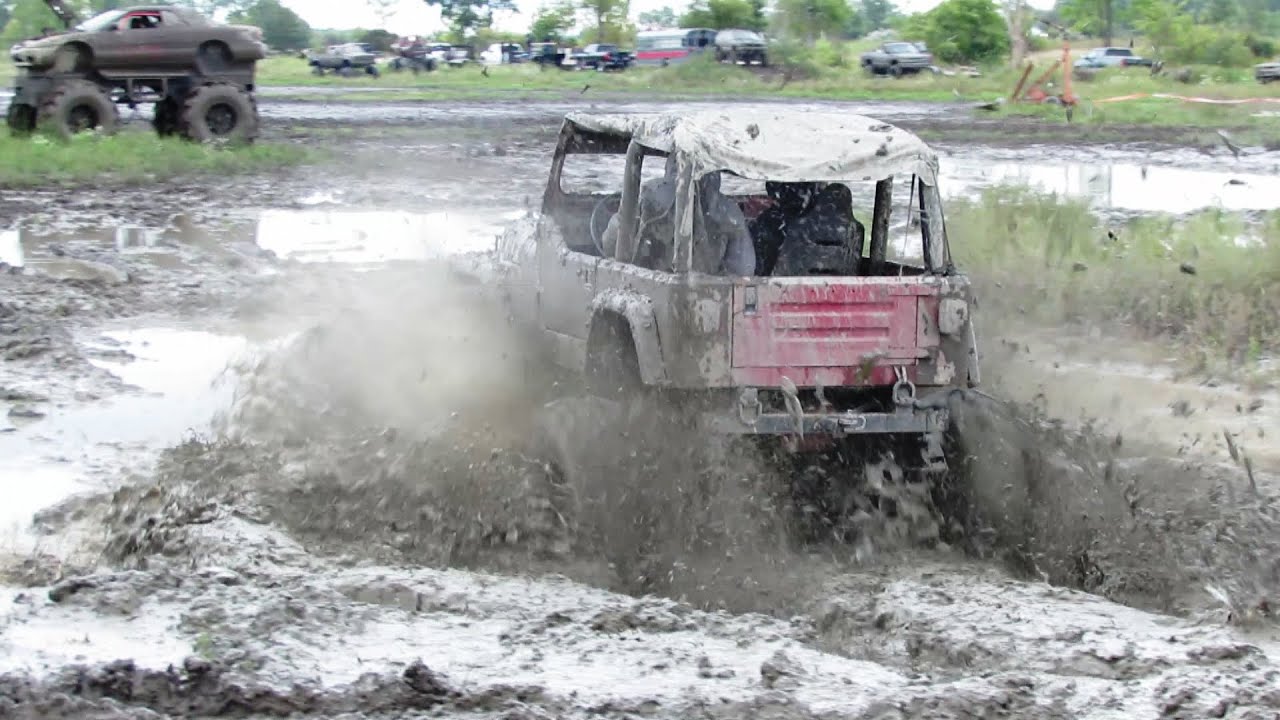 Red Jeep Goes Mudding At Country Compound Mud Bog - YouTube