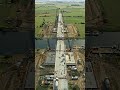From a broken path divided by the river to a bridge that reconnects the land