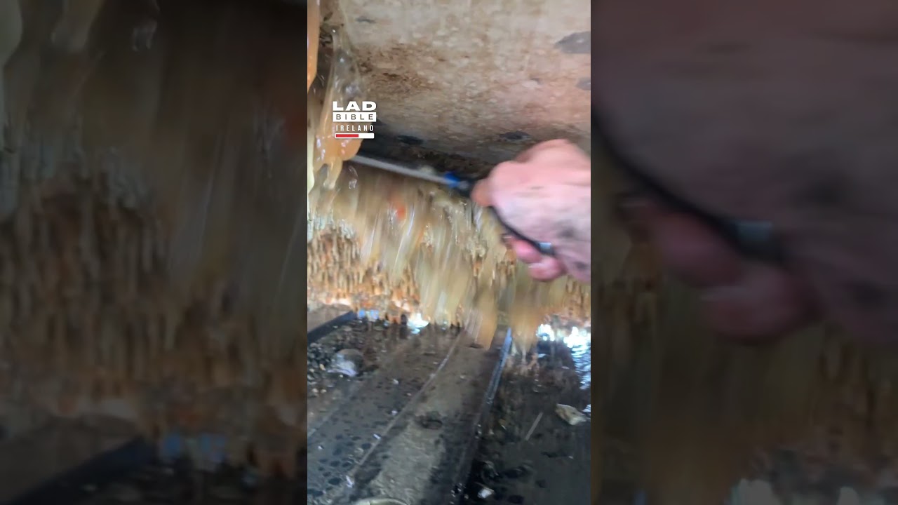 Scraping Gunk off a Lobster Boat