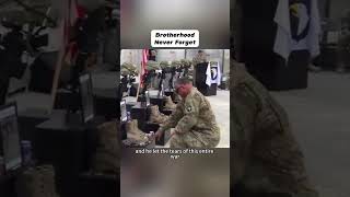 U.S. Sergeant Major overcome, kneels weeping at memorial for fallen comrades