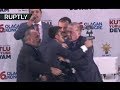 Erdo-hug: Fan rushes on stage to embrace Turkish president