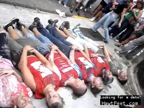 Brazilian girls walking over boys as they cover their balls (femdom)