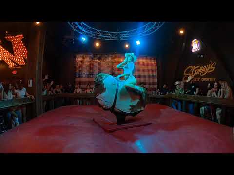 Bikini mechanical bull riding in Las Vegas: A cowgirl goes for 1st place on a frisky bull
