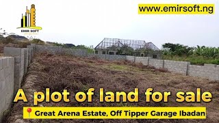 A plot of land fenced for sale in Ibadan at a distressed price.
