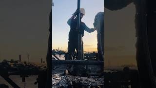 Oilfield Running Pipe at Sunrise
