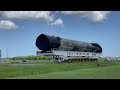 SpaceX Falcon 9 booster on the road to hangar after space station cargo mission