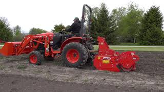 ever seen a power harrow? planting sweet corn in garden!